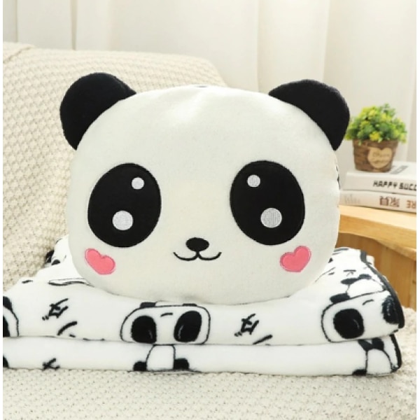 Peluche panda amoureux avec couverture dans un canapé