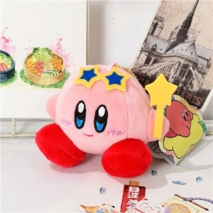 Peluche Kirby rose avec étoiles bleues sur la tete
