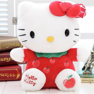 Peluche Hello Kitty toute mignonne avec papillon rouge assis devant des livres