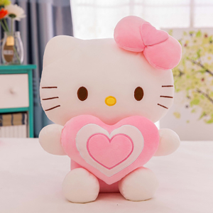 Peluche Hello Kitty avec un cœur assis sur une table